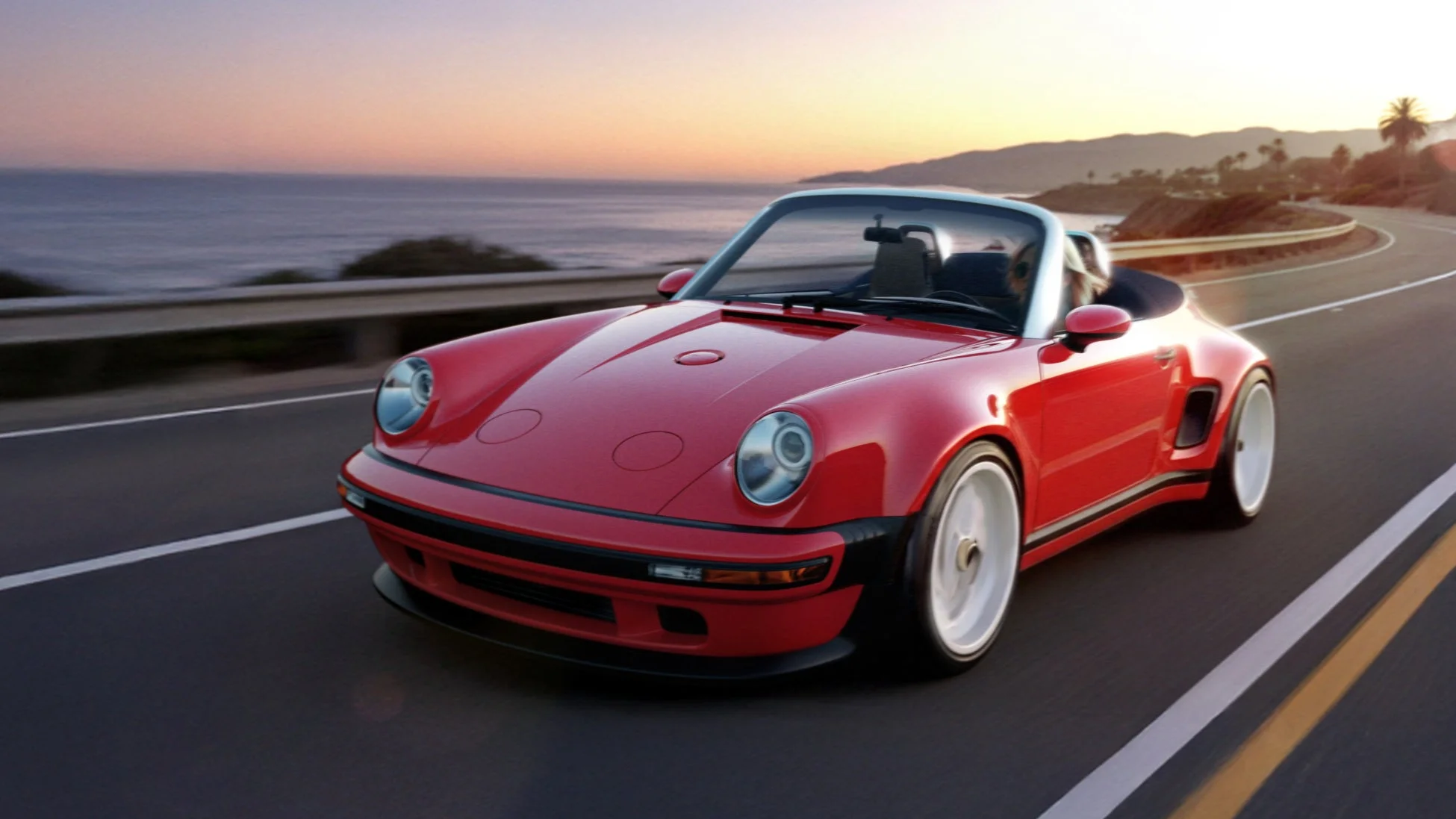 夕焼けの海岸線を走る赤いオープンカー