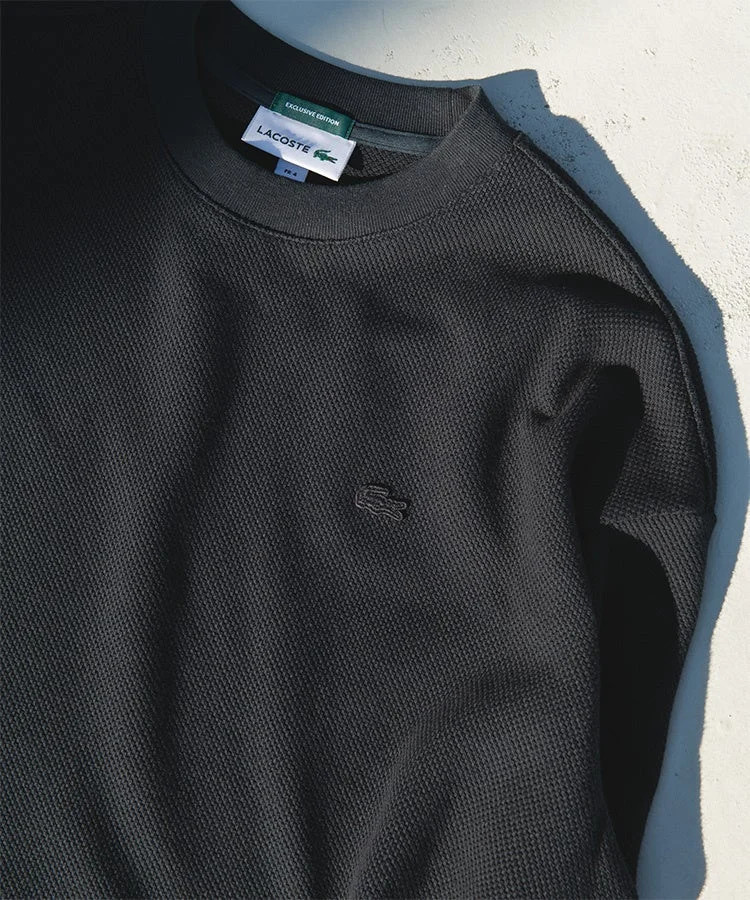 ラコステの黒い長袖トップス